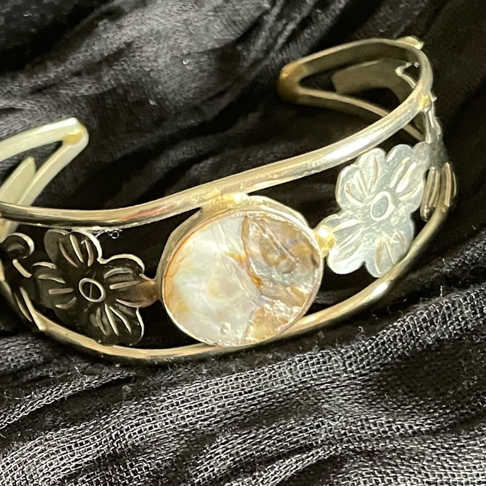 Silver bracelet with stone and etched detailing.